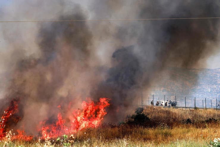 אש בחווארה (צילום: Jaafar ASHTIYEH / AFP) מתנחלים הציתו אש בחווארה