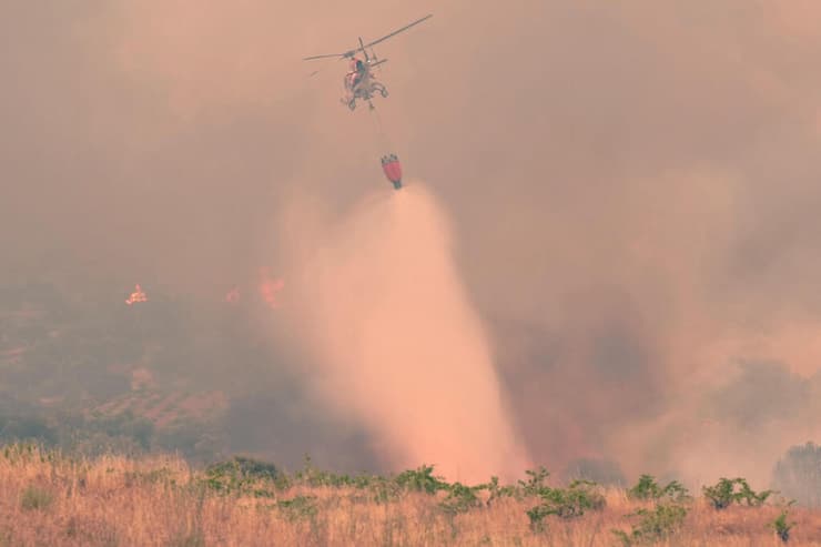 צילום: Cesar MANSO / AFP שריפה באזור סבררוס ליד אבילה בספרד