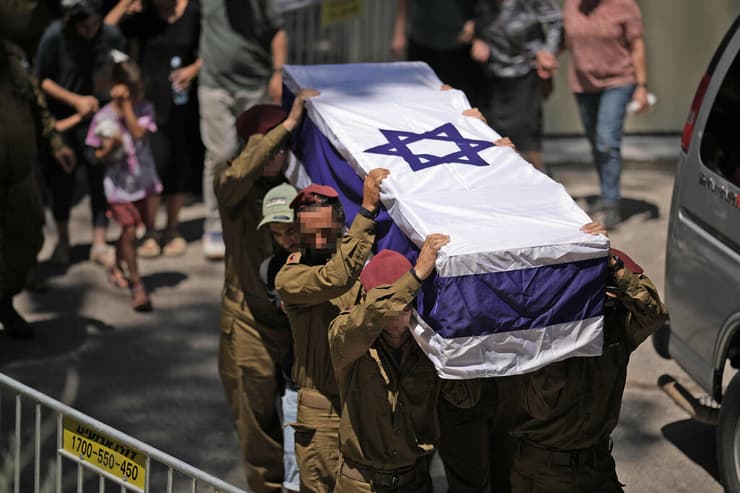 צילום: AP Photo/Leo Correa רס"ן (במיל') הראל בירנשטוק ז"ל מובא למנוחות