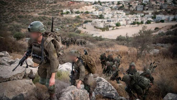 פועלים באיו"ש - מתכוננים ללבנון. לוחמי חטיבת הנח"ל (צילום: דובר צה"ל) לוחמי חטיבת הנח"ל