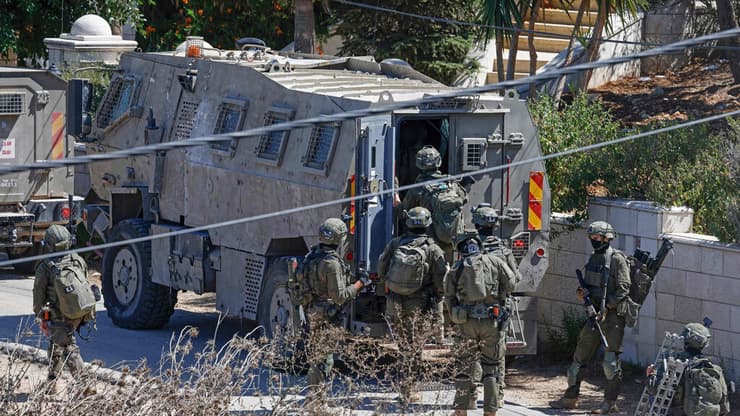 פשיטת צה"ל בעיירה בידו, במהלך כיפור (צילום: AFP) פשיטת צה"ל בעיירה בידו