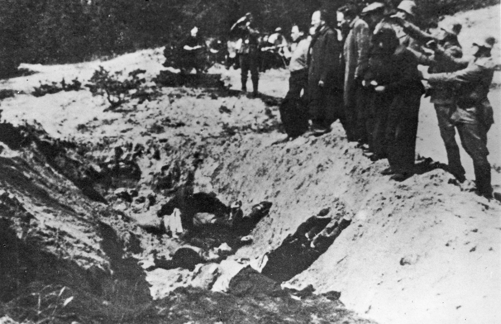 Nazi SS troops line up Kyiv Jews in front of the shooting pit during the Babi Yar massacre 
