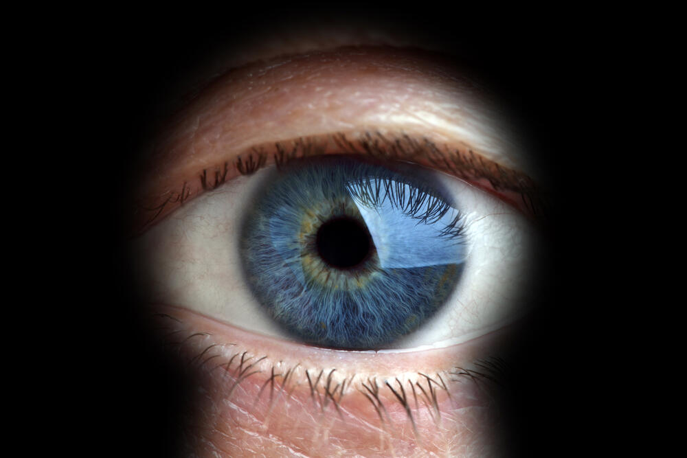 Image of a person looking through a peephole, illustration 