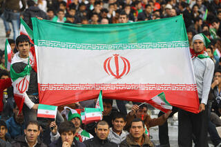 Iranian sports fans cheer on the national team