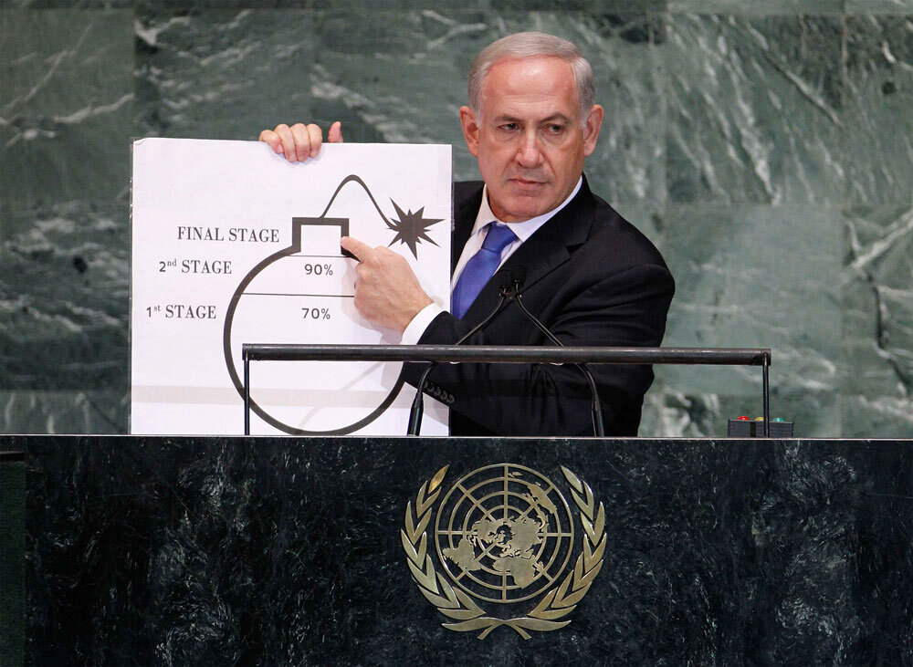 Benjamin Netanyahu holds up a diagram featuring a cartoonish drawing of a bomb he used as a prop to illustrate what he sees as Iran's drive for an atomic weapon during his speech at the UN General Assembly, September 27, 2012 