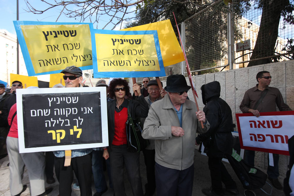 Holocaust survivors protesting in front of the Finance Ministry in Jerusalem  