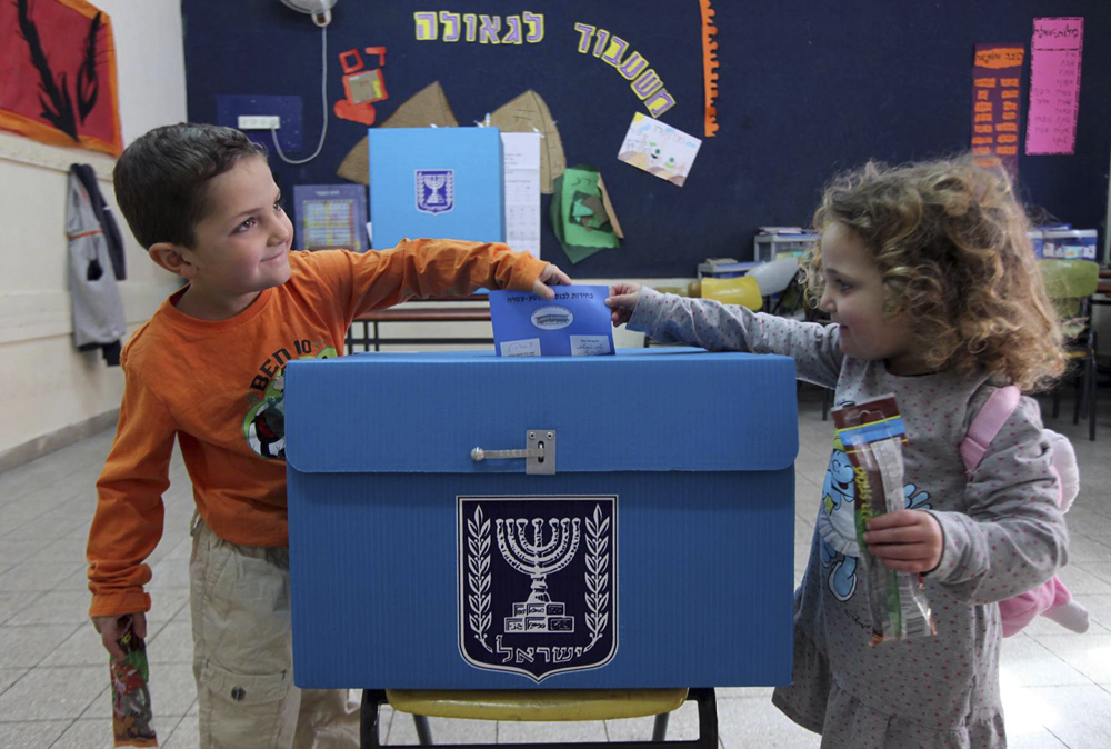 Children at a polling station during the March 2021 elections 