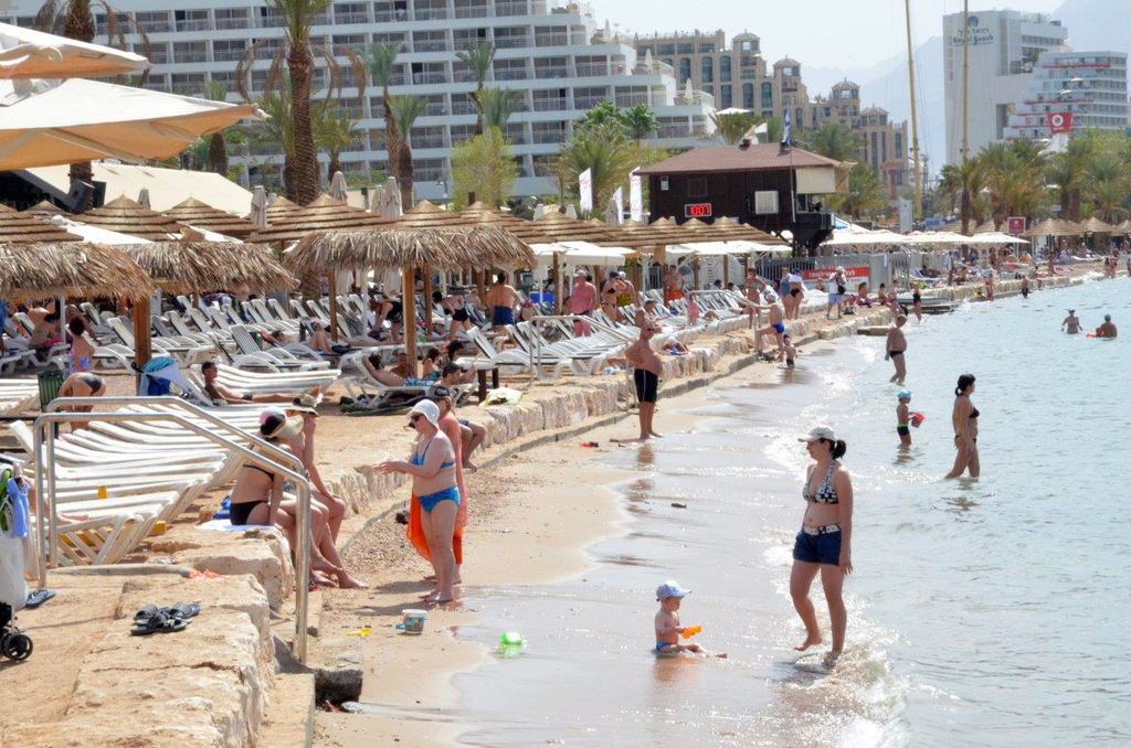 Tourists on the beach in the southern resort town of Eilat 