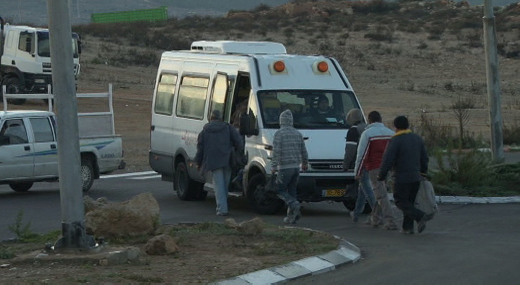 Palestinian workers return to the West Bank from working in Israel 