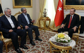 Hamas leaders Ismail Haniyeh and Khaled Mashal with Turkish President Erdogan 