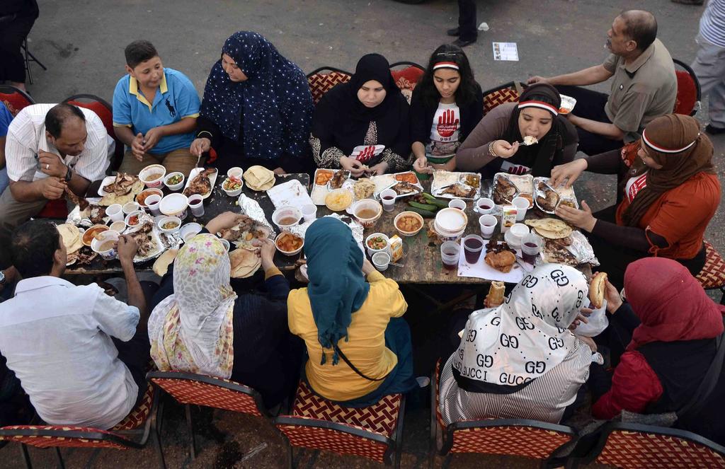 Muslim family having a traditional iftar meal together 
