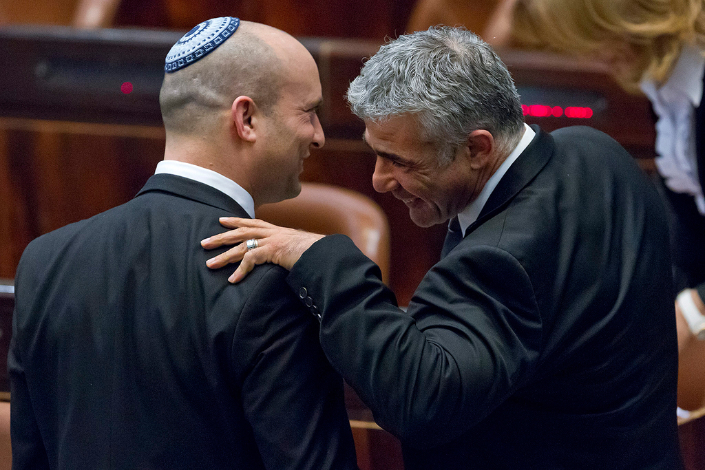 Yamina leader Naftali Bennet and Yesh Atid leader Yair Lapid in the Knesset in 2014 