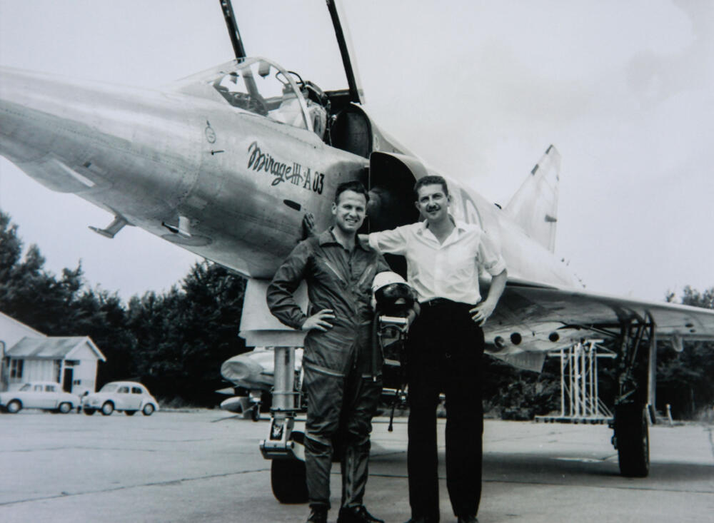 Shapira (left) standing in front of a French-made Mirage fighter jet 