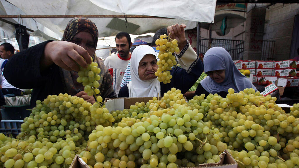 Gazan women shop at a local market 