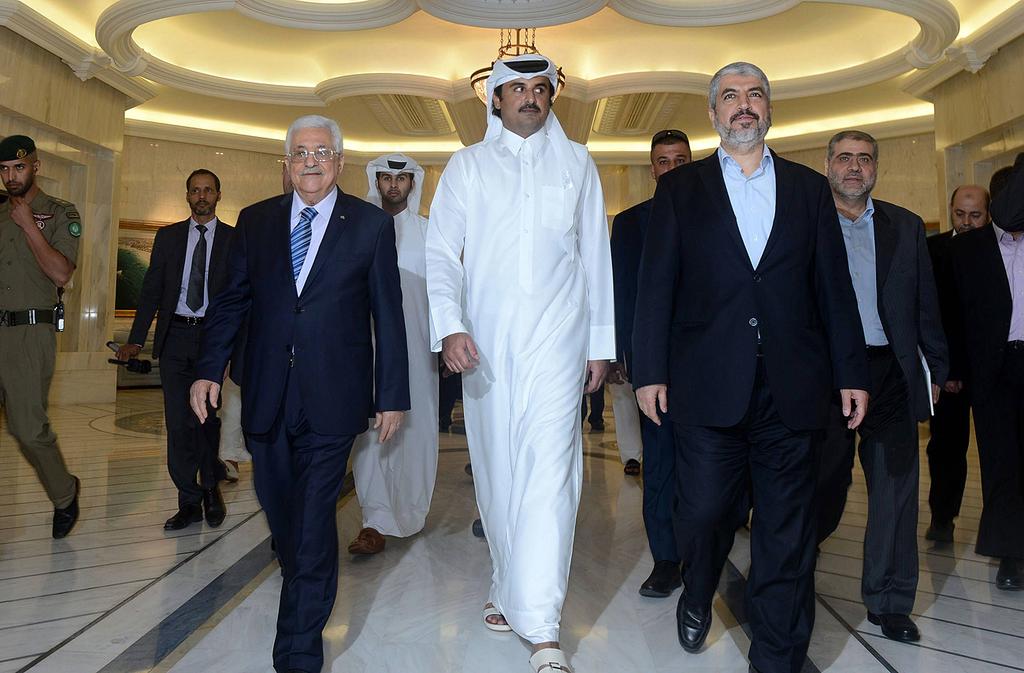 L-R: Palestinian President Mahmoud Abbas, Qatari Emir Tamim bin Hamad Al Thani and Hamas leader Khaled Mashal 
