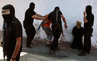 Hamas terrorists executing collaborators 
