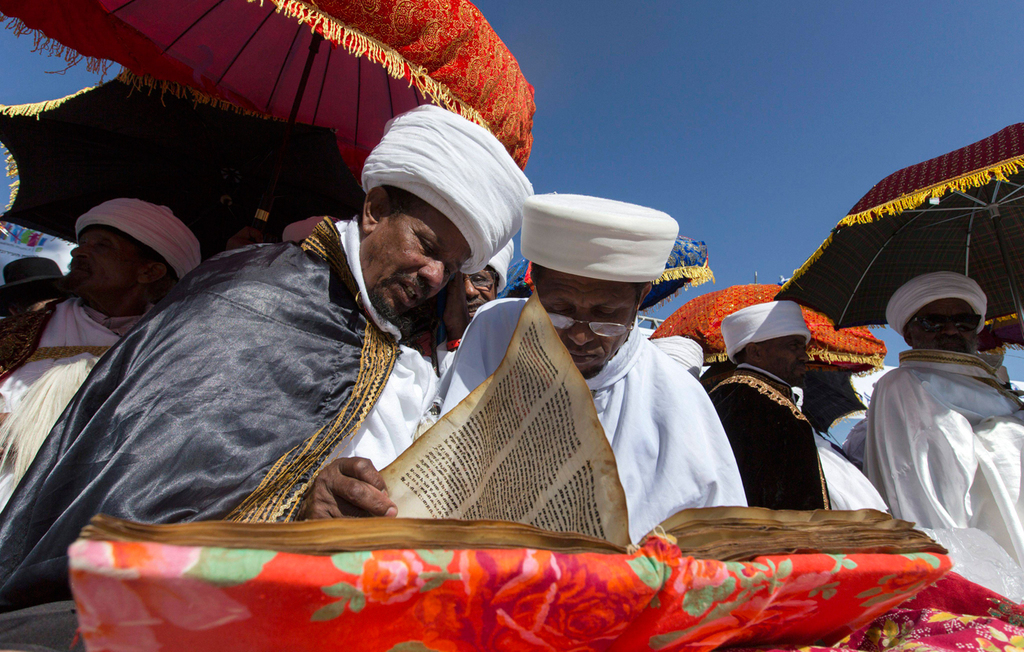 Ethiopian Jewish priests, known as Qes, read from the Torah during a Sigd prayer sermon, November 21, 2014 