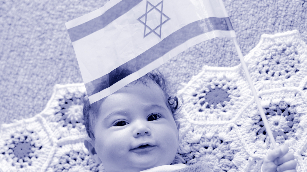 A baby holding Israeli flag 
