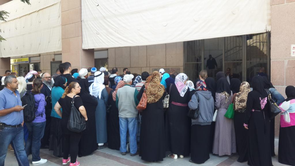 People congregating outside the unemployment bureau in Be'er Sheva during coronavirus outbreak 