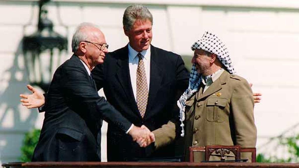 (L-R) Prime Minister Yitzhak Rabin, U.S. President Bill Clinton and Palestinian President Yasser Arafat signing the 1993 Oslo Accords 