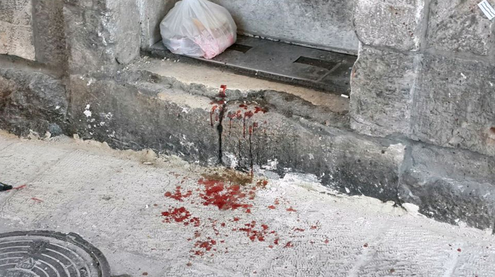 Blood in the alley of the Old City of Jerusalem following a terror attack 