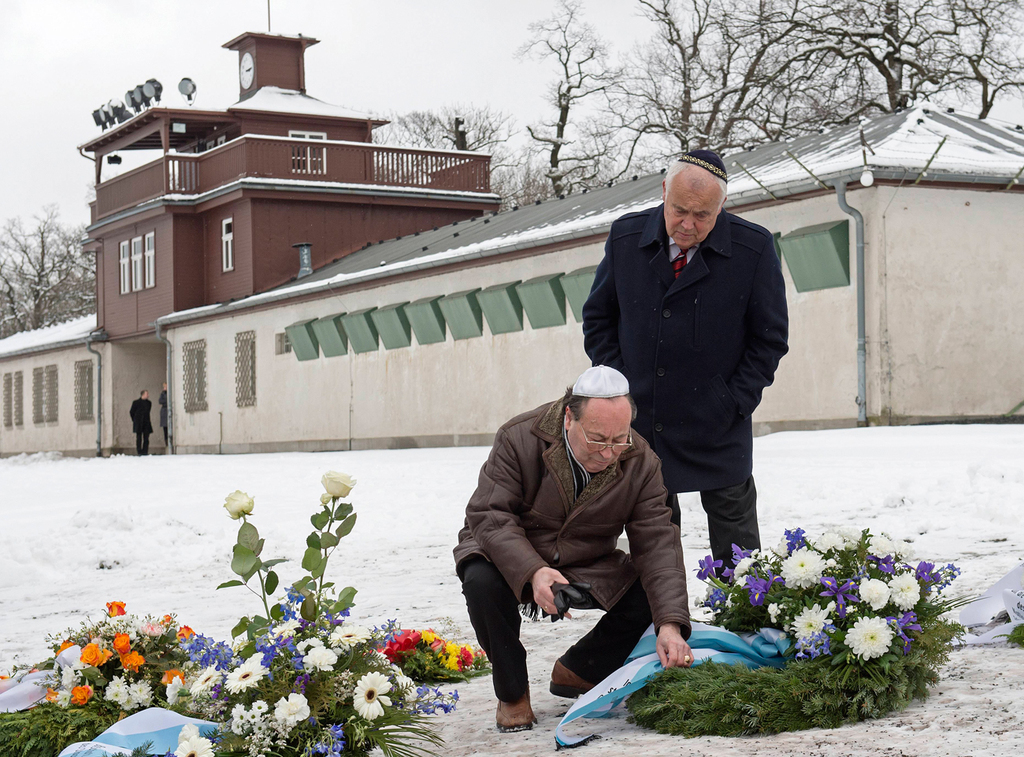 Local Jews in Thuringia place flowers at the mass graves during Holocaust Remembrance Day 