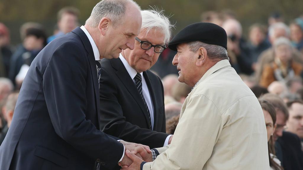 German President Frank-Walter Steinmeier, center, attends a Holocaust memorial service 