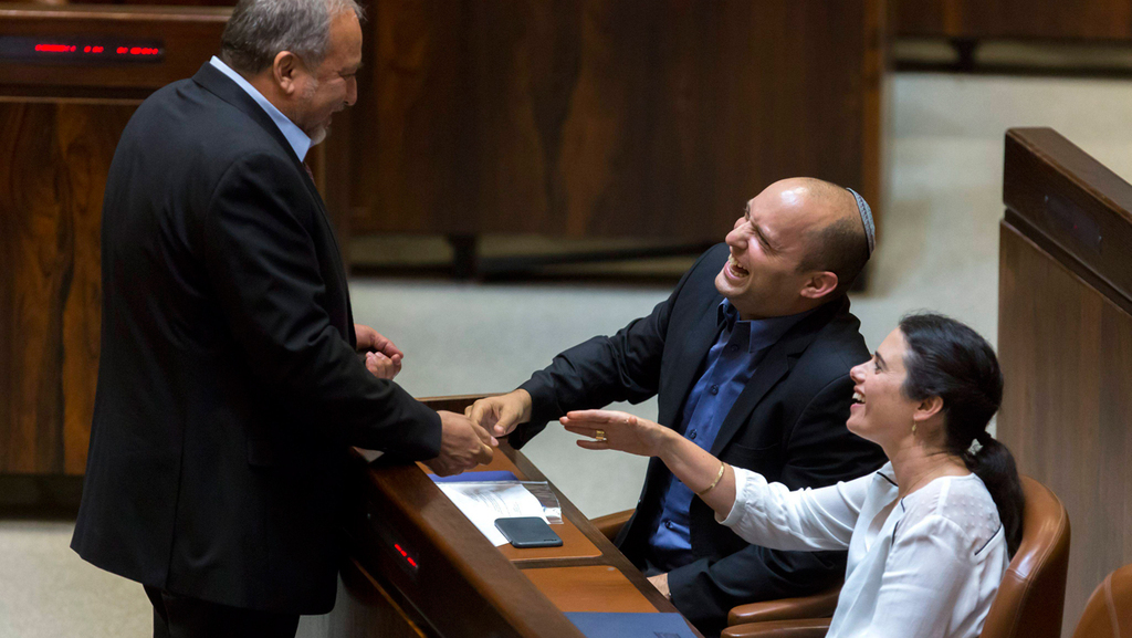 Avigdor Liberman with Naftali Bennet and Ayelet Shaked in the Knesset in 2015 