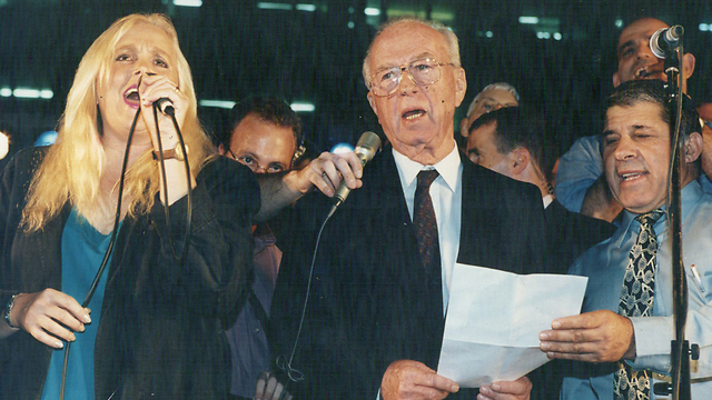 Prime Minister Yitzhak Rabin attends a peace rally in Tel Aviv shortly before his murder by a far-right Jewish extremist 