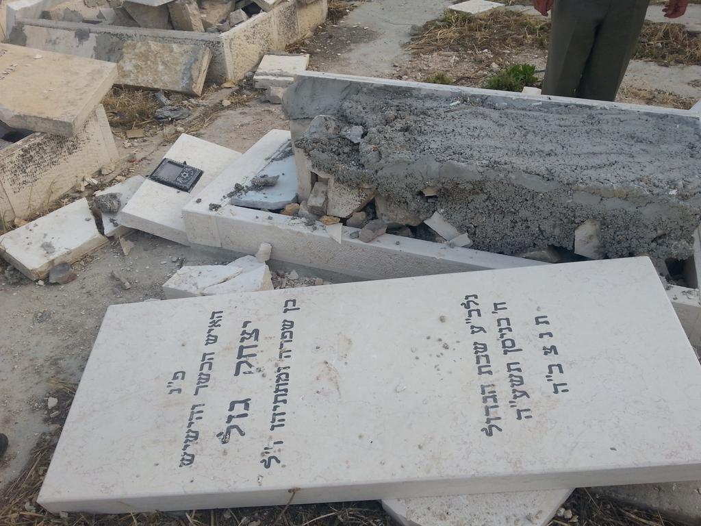 The desecration of graves at the Jewish cemetery on the Mount of Olives in Jerusalem 