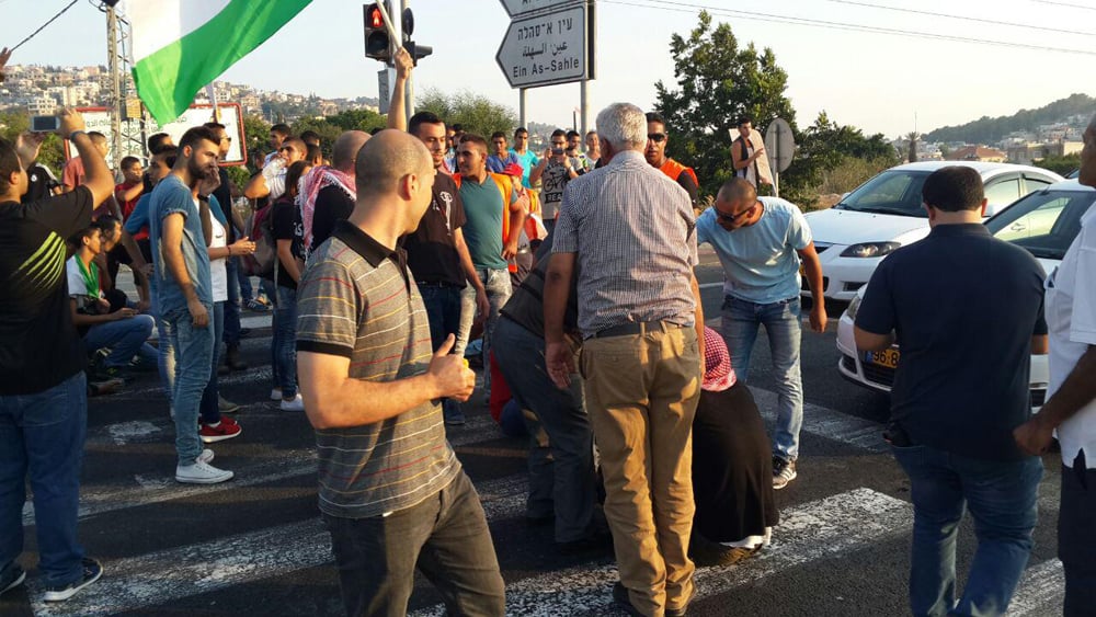 Israelis demonstrating against the arson attack in 2015 