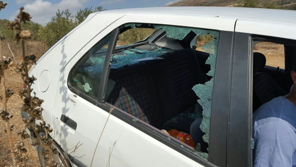 A Palestinian farmer's car is vandalized during a 2020 attack on olive farmers by Yitzhar settlers 