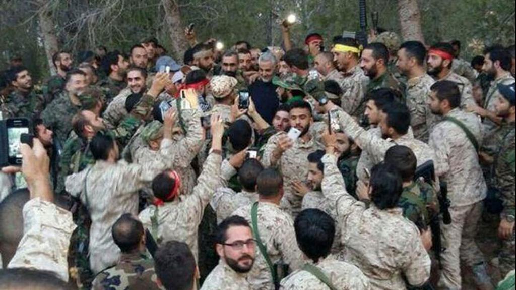 Qassem Soleimani with fighters from the Iranian-backed Hezbollah group 