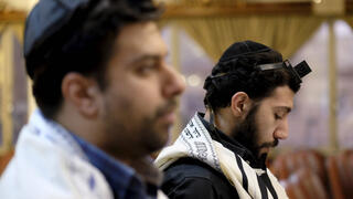 Jewish men praying in Iran 
