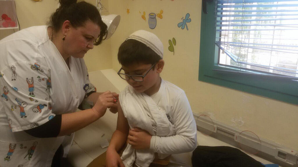 A child receives a flu vaccine 