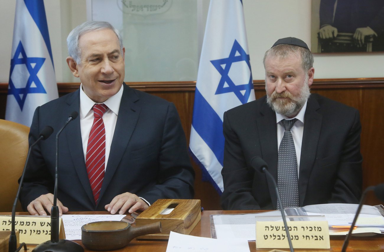 Prime Minister Benjamin Netanyahu and Attorney General Avichai Mandelblit , during his stint as cabinet secretary