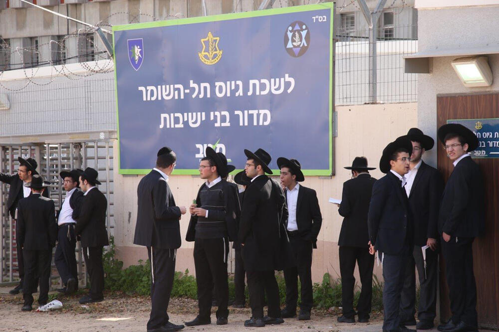 Haredi men outside an IDF recruitment office 