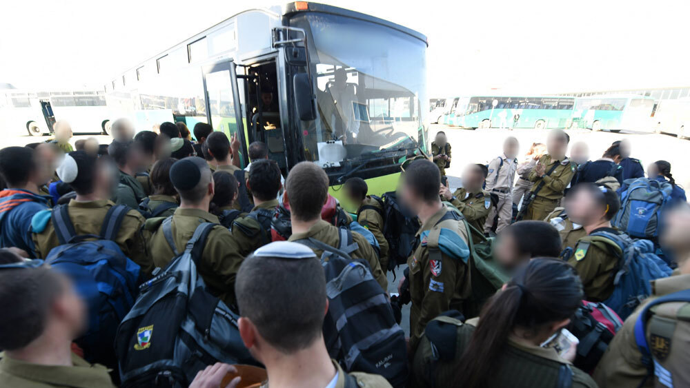 Crowded lines of soldiers waiting to board a bus at Be'er Sheba Centeral Station 