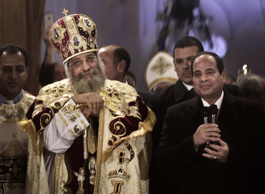 Egyptian President Abdel Fattah el-Sisi and a Coptic Christian leader 