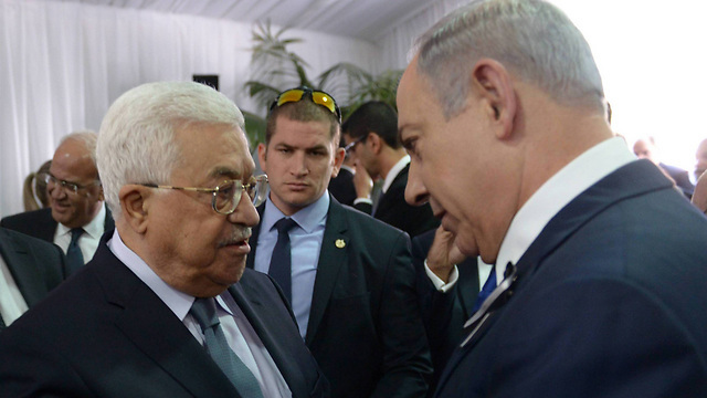 Mahmoud Abbas and Benjamin Netanyahu meeting at Shimon Peres' funeral in Jerusalem, Sept. 2016 