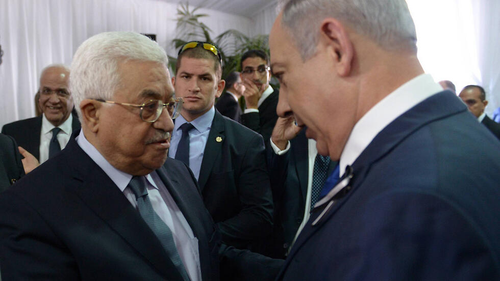 Mahmoud Abbas and Benjamin Netanyahu at the funeral for former president Shimon Peres in 2016