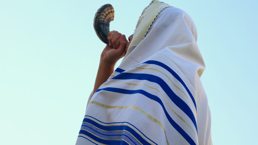 Jewish man blasts the shofar 