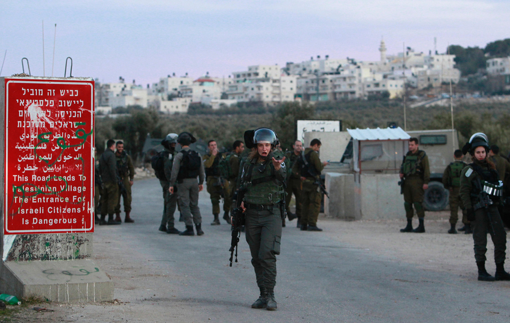Israeli soldiers at a West Bank checkpoint 