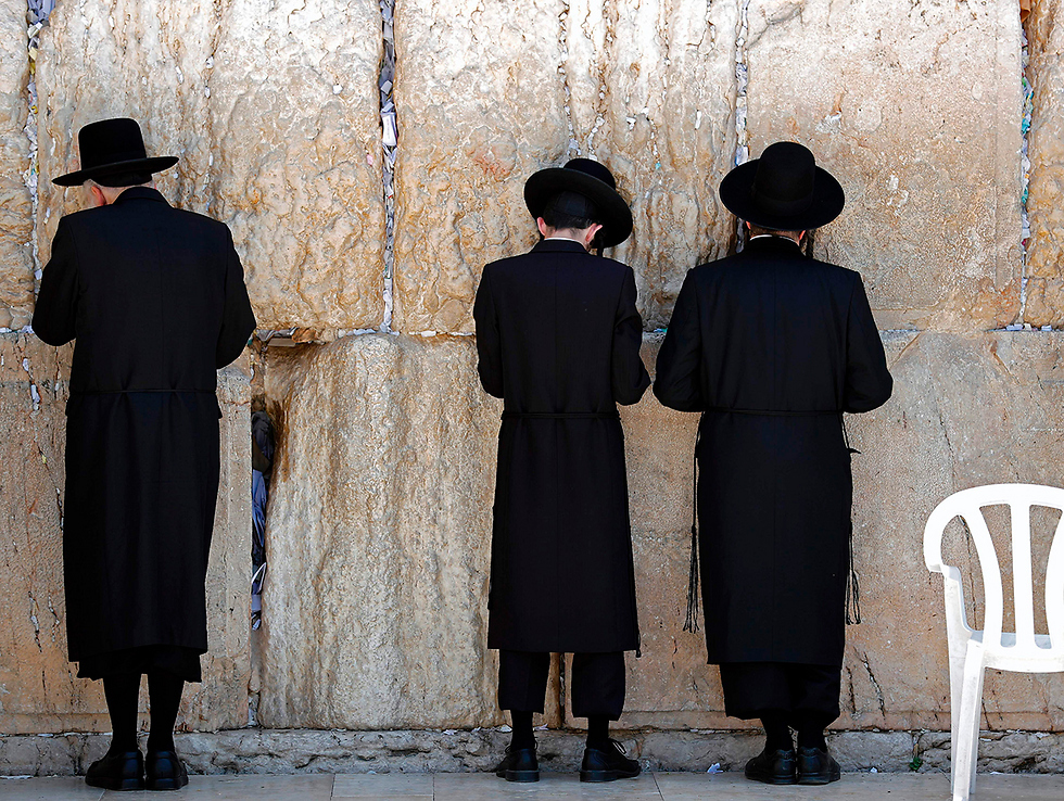 Haredi men praying at the Western Wall in Jerusalem 