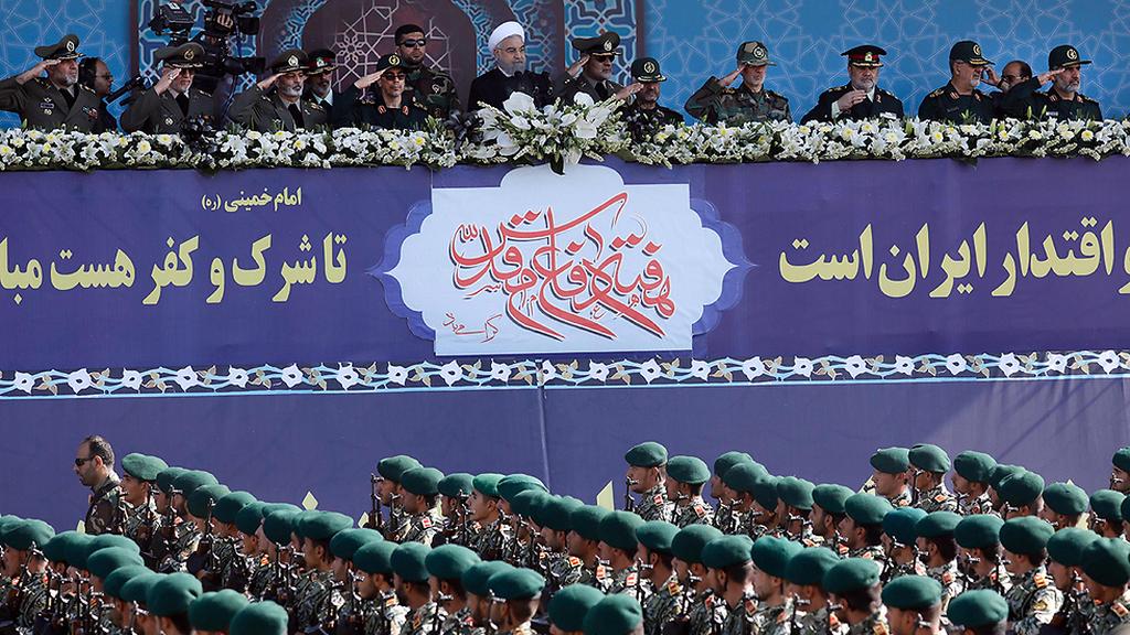 Iranian President Hassan Rouhani overseeing a military parade in Tehran 