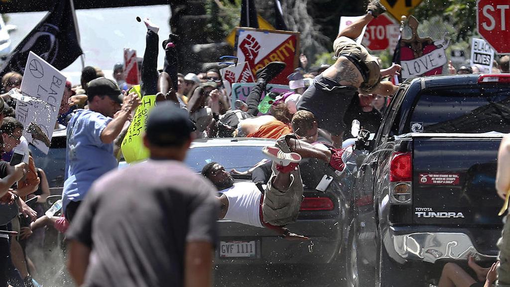 A white supremacist drives his car into anti-fascist protesters in Charlottesville, August 2017 