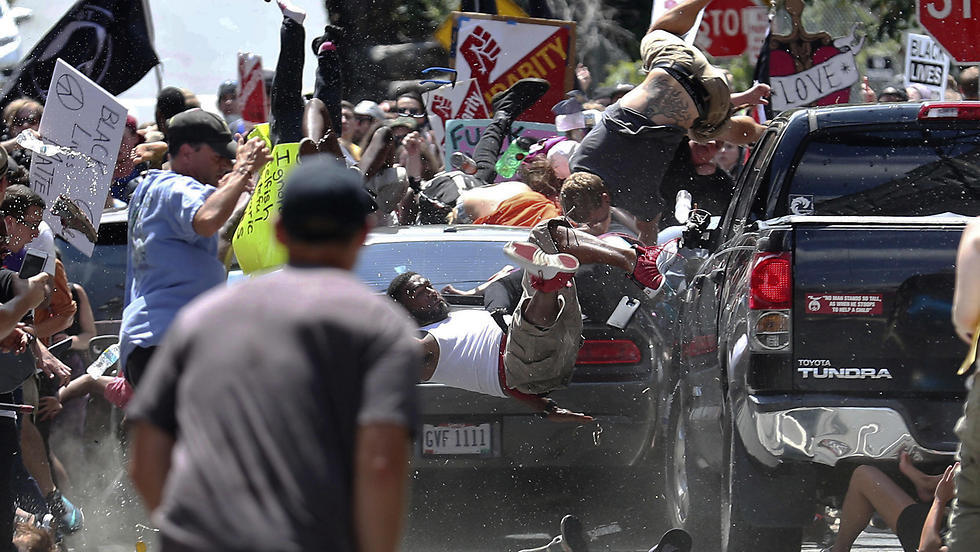 An alt-right fascist plows his car into crowd  of counter-demonstrators in Charlottesville, Virginia in 2017  