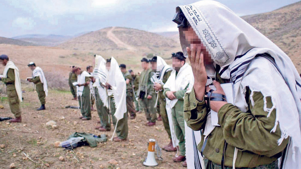 Haredi IDF troops praying during service 