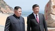 קים ג'ונג און שליט צפון קוריאה מבקר ב סין עם שי ג'ינפינג