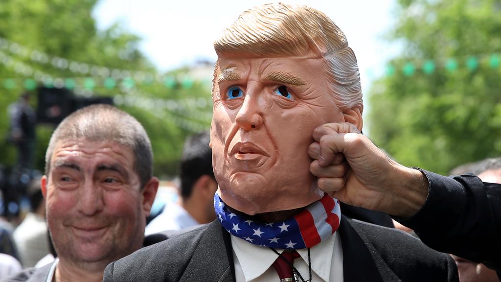  Mask of Donald Trump punched by protester in Iran 